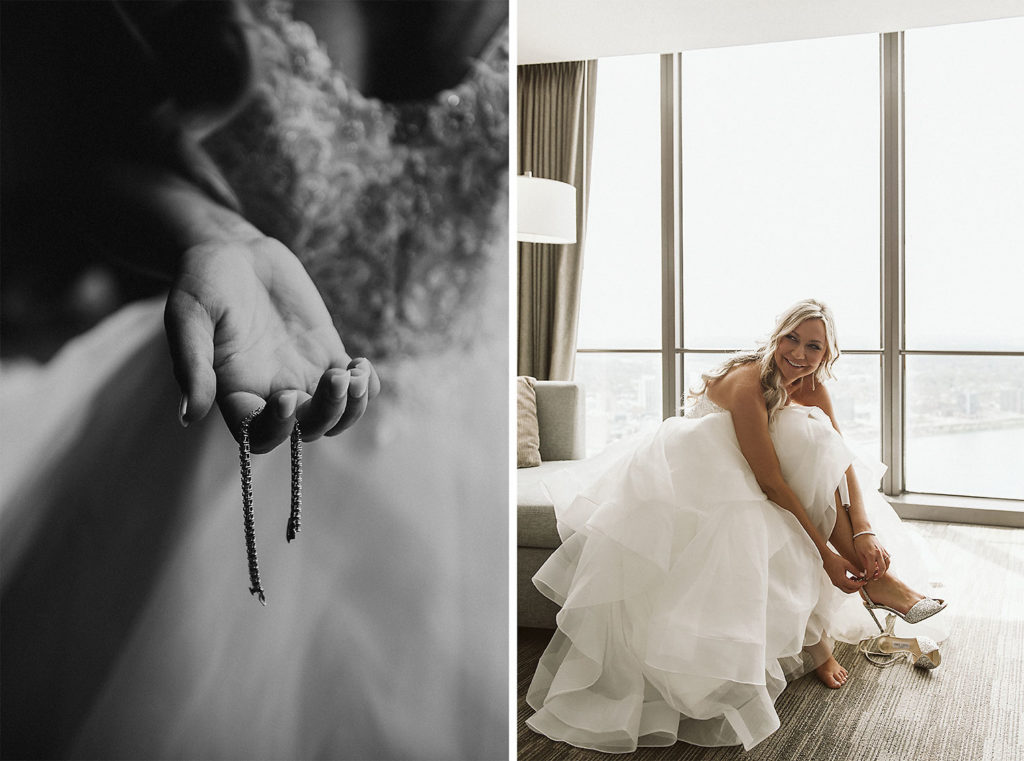 Bride laughing while she puts on her shoes